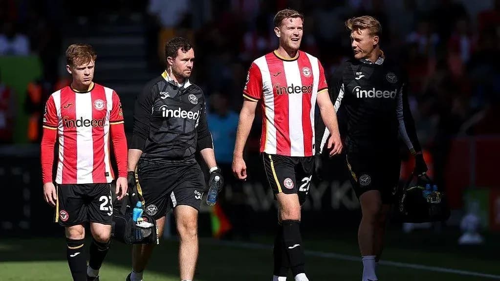Brentford players walking off the pitch after match