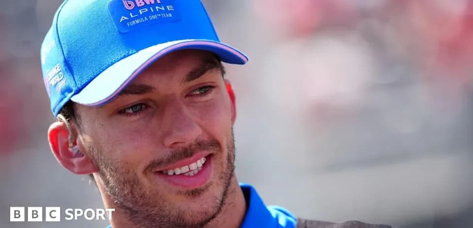 Driver wearing Alpine cap at racing event