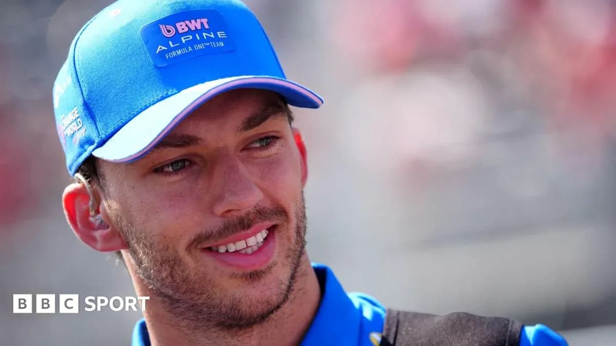 Driver wearing Alpine cap at racing event