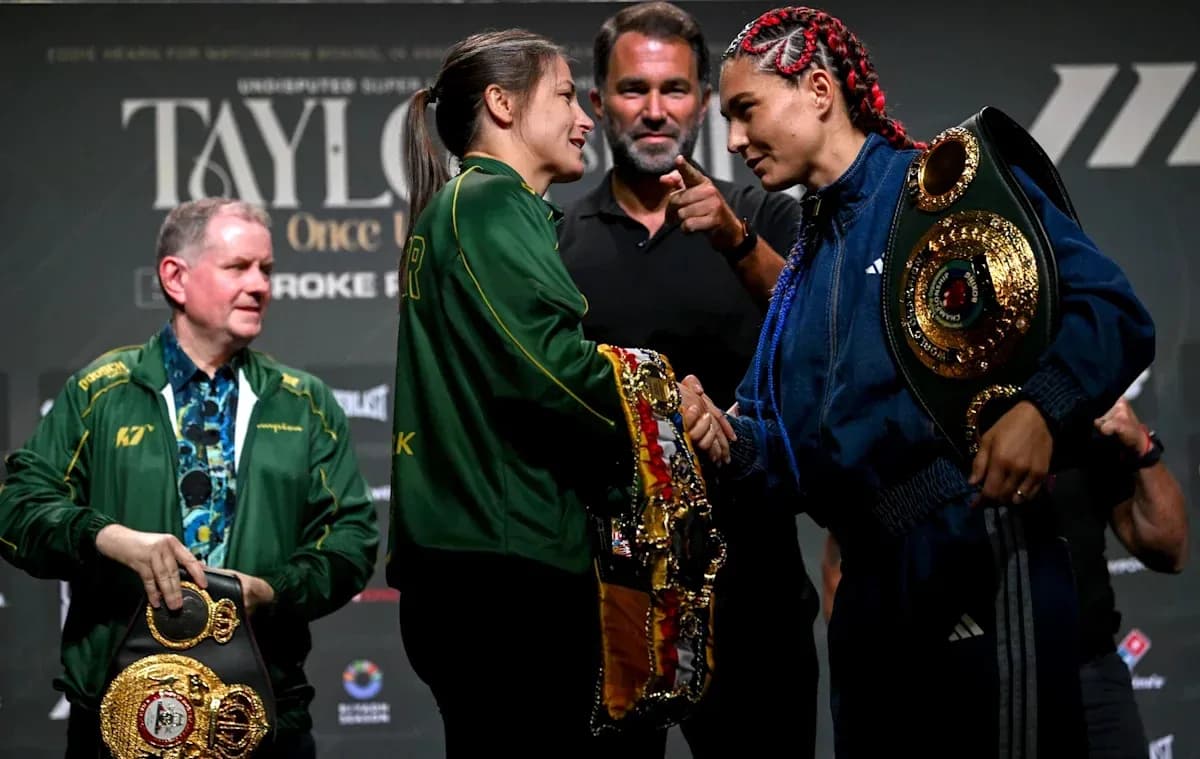 Boxers shaking hands at press conference with belts