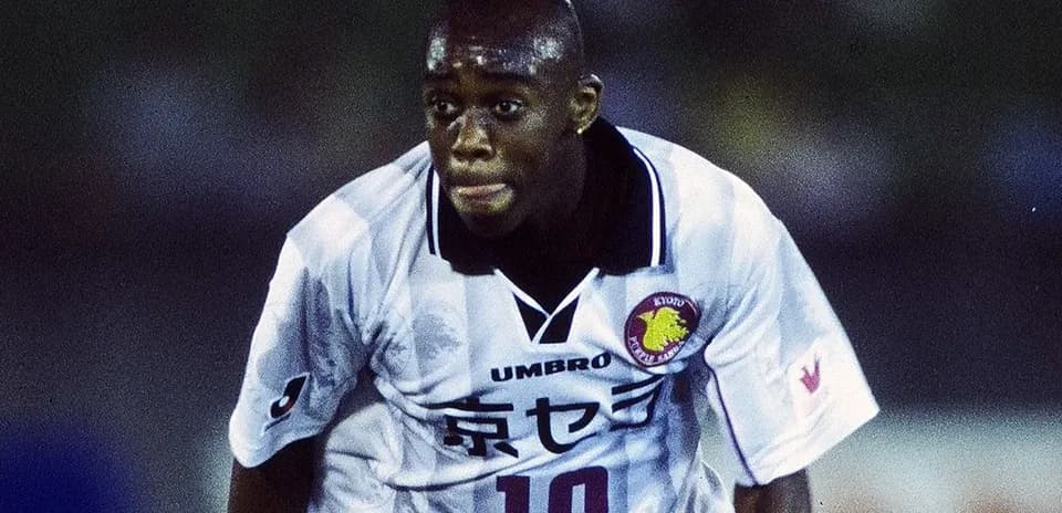 Player in action wearing white jersey with number 10