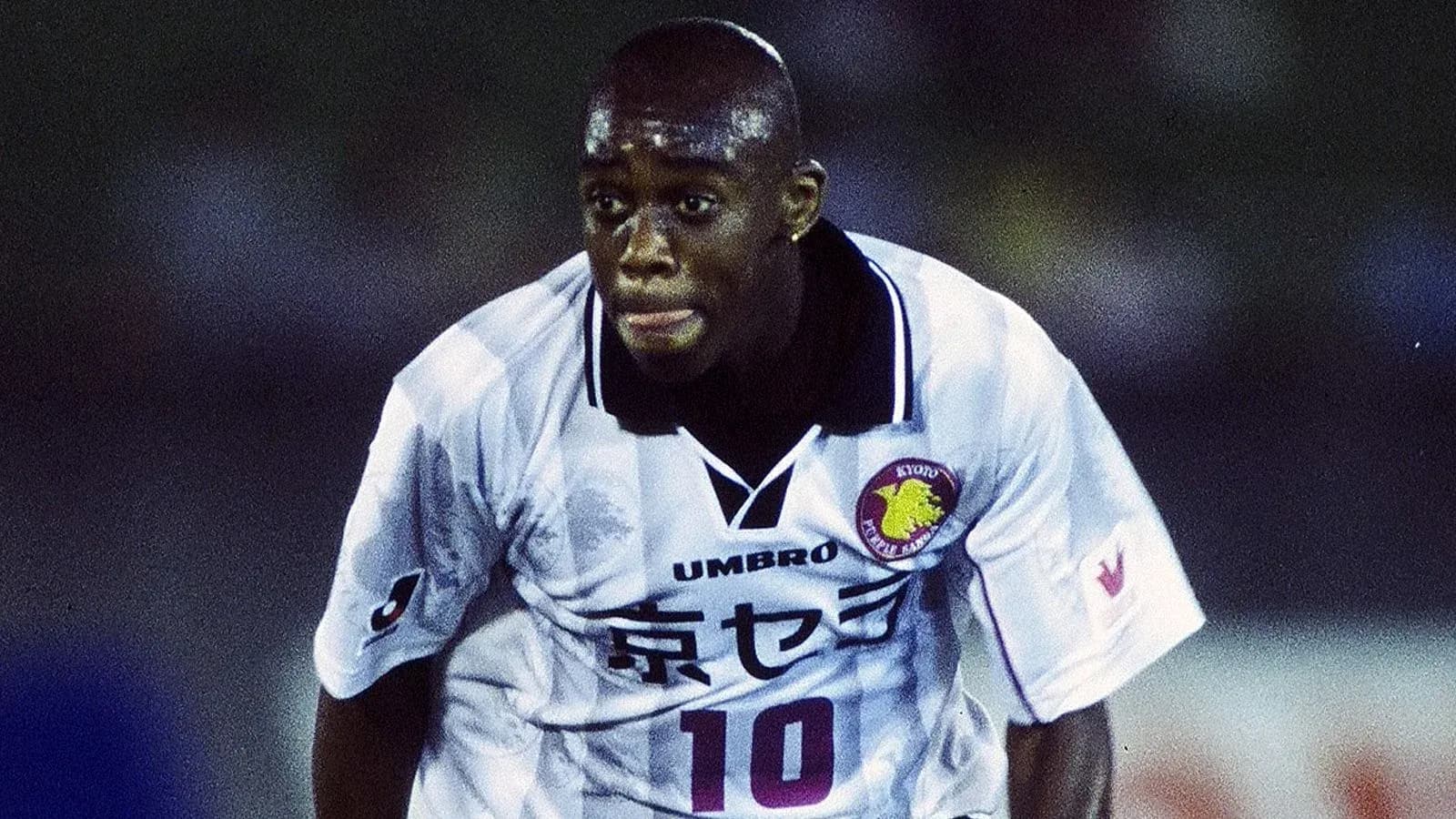 Player in action wearing white jersey with number 10