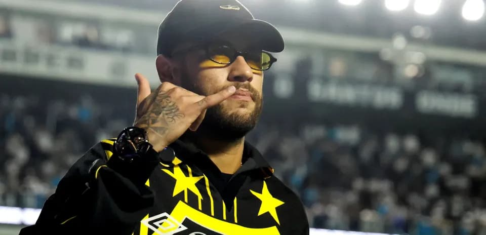 Man in sunglasses making a gesture at stadium