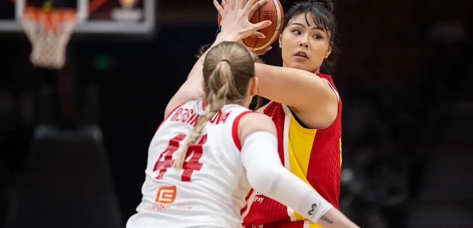 Player passing ball while being closely guarded