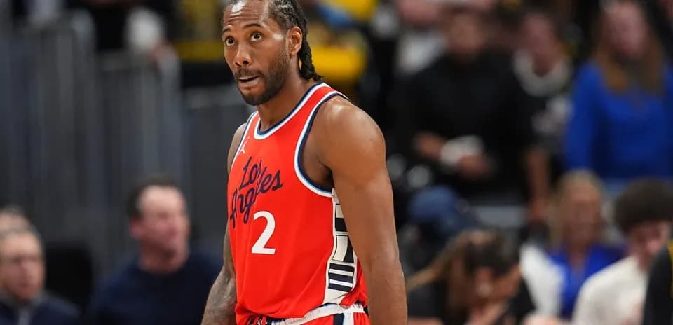 Kawhi Leonard in red Los Angeles jersey on court