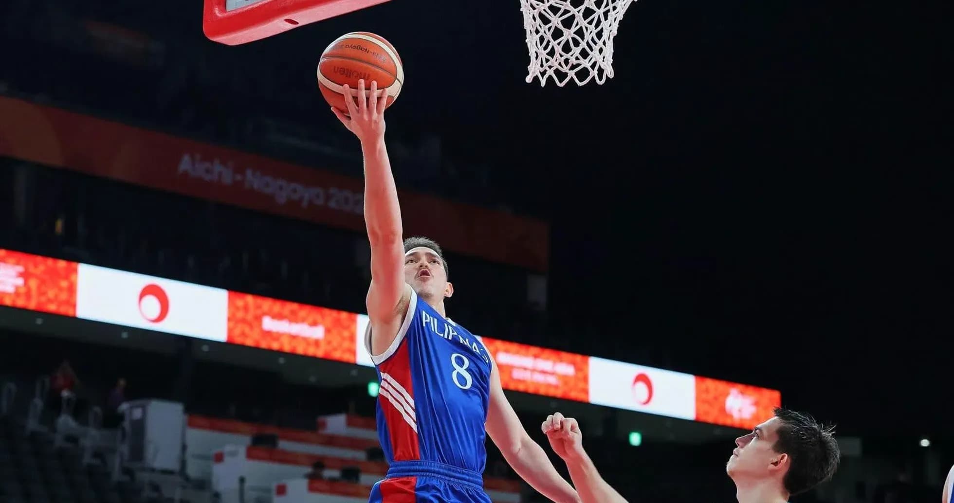 Player shooting a basketball during a game