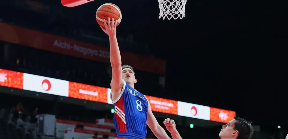 Player shooting a basketball during a game