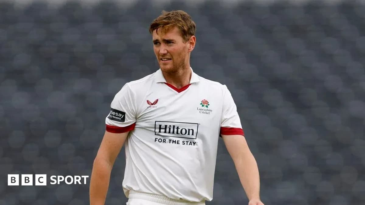 Cricketer wearing Lancashire shirt on the field