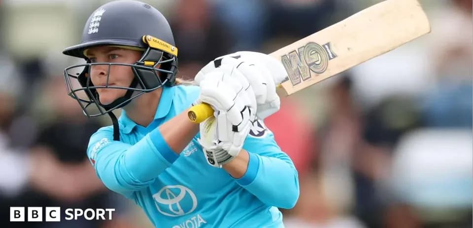 Cricketer batting during a match at the stadium