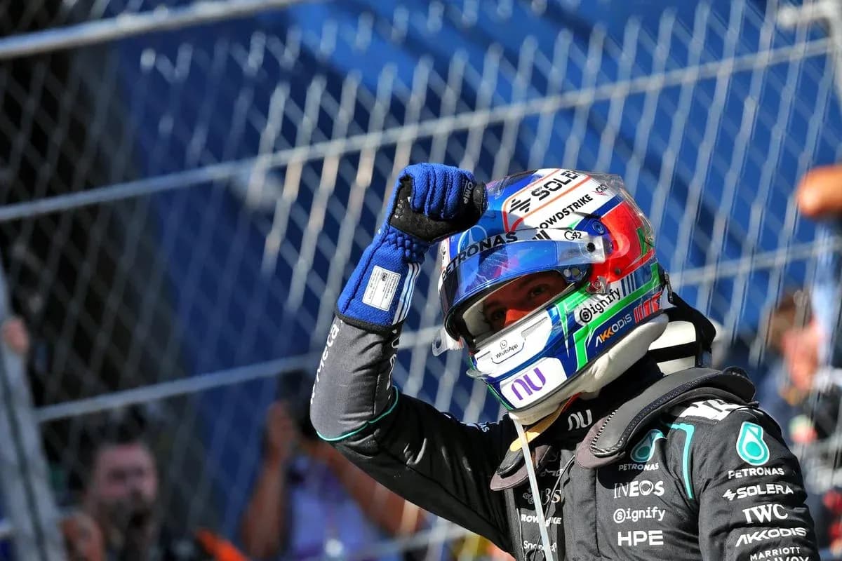 Driver celebrating after race victory in pit area