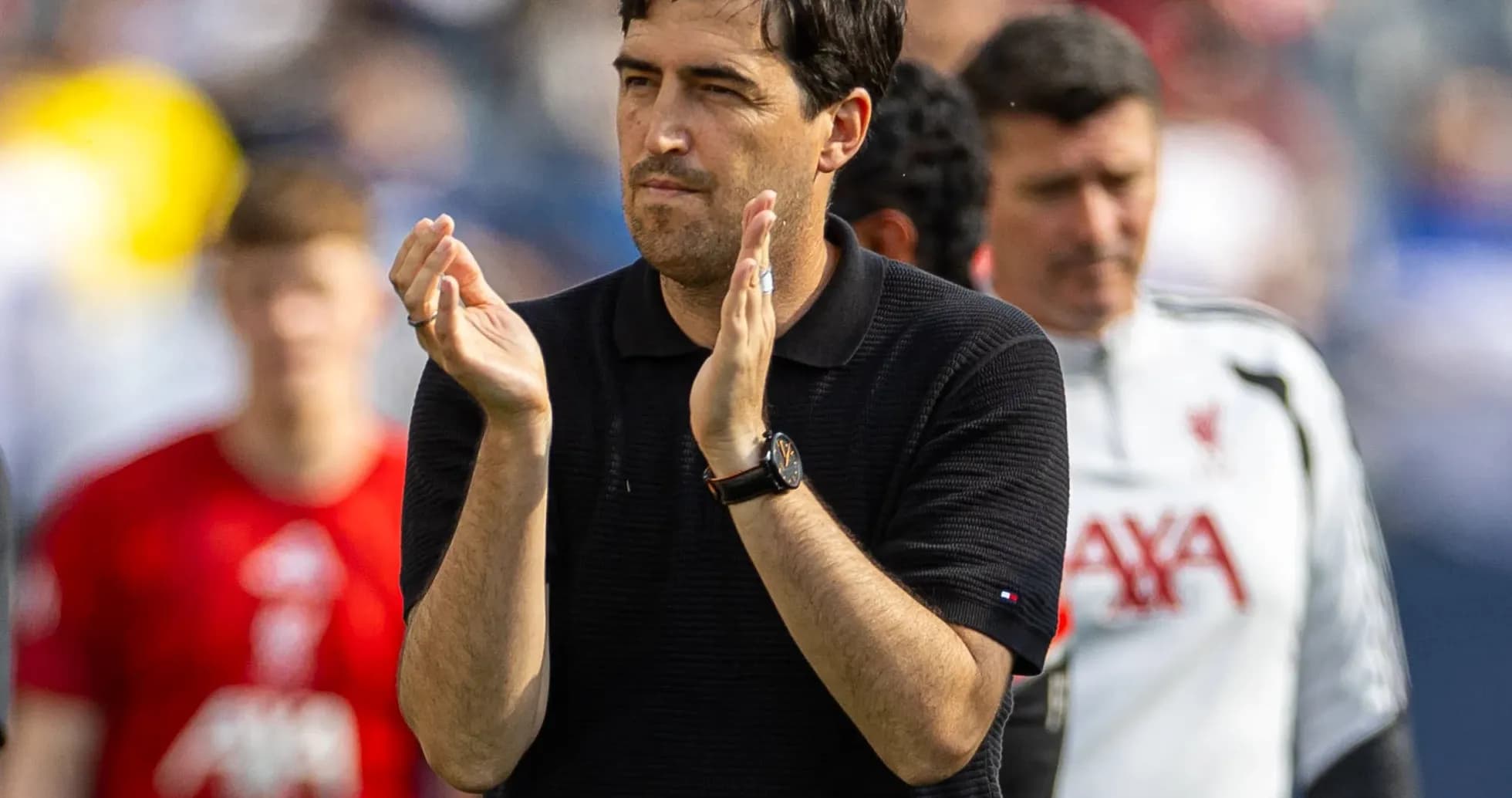 Coach applauding during team warm-up session