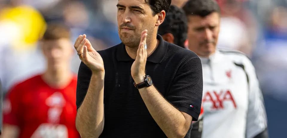 Coach applauding during team warm-up session