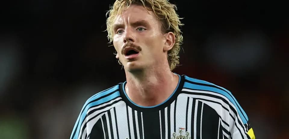 Newcastle United player in striped jersey during match