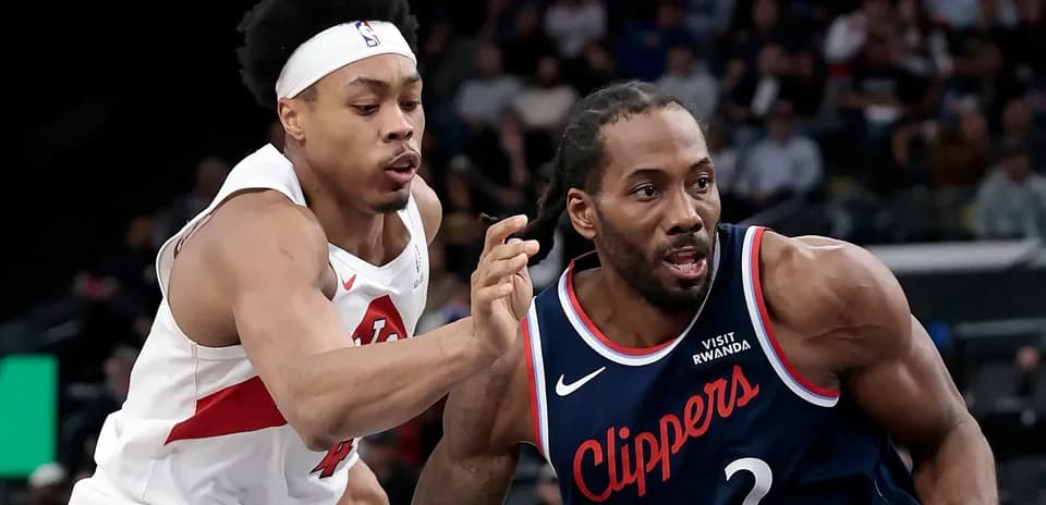 Two players competing for the ball during NBA game