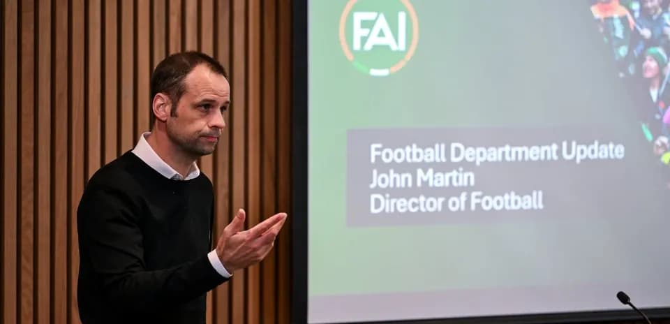 Man speaking at football department update presentation