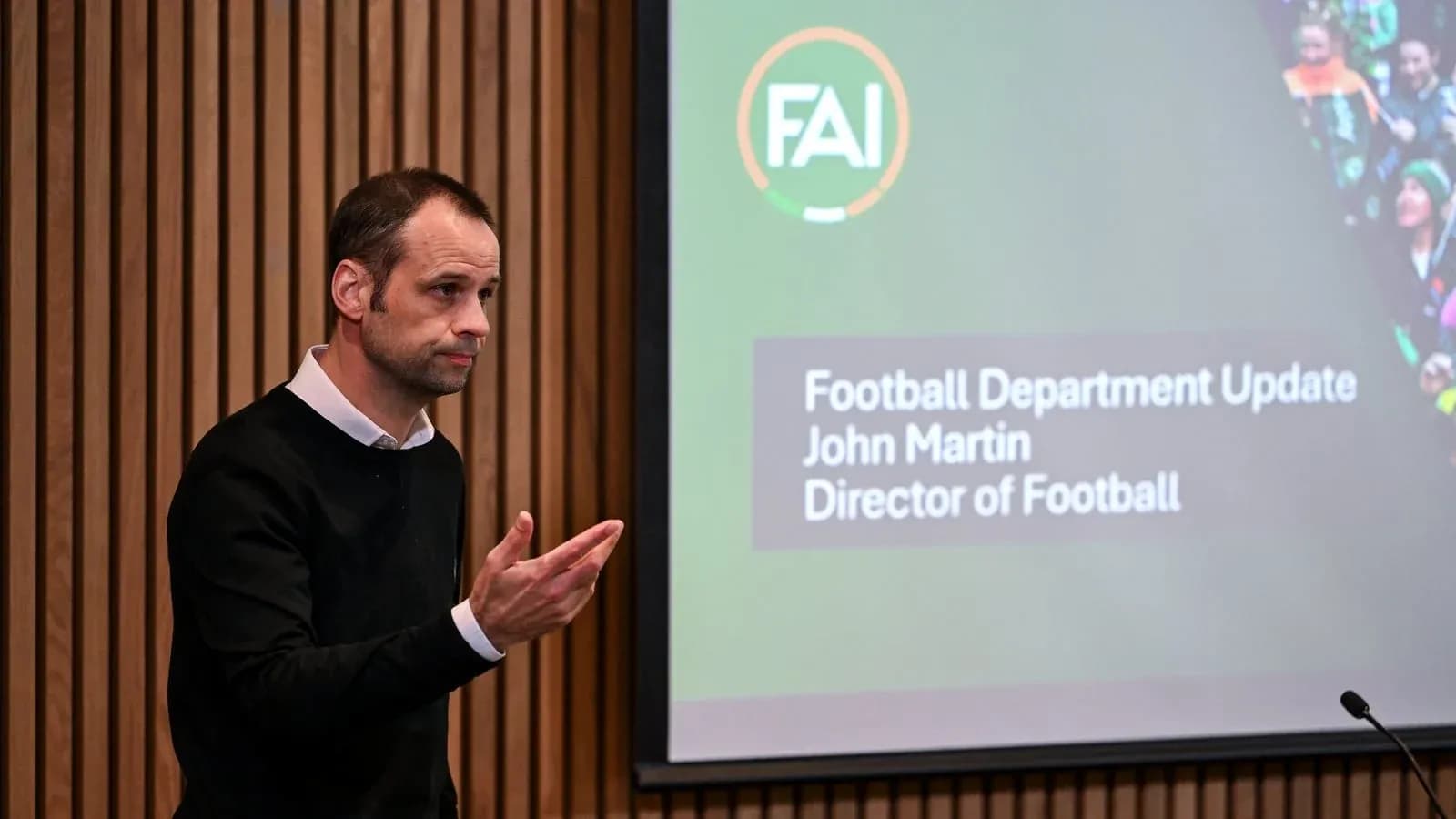 Man speaking at football department update presentation