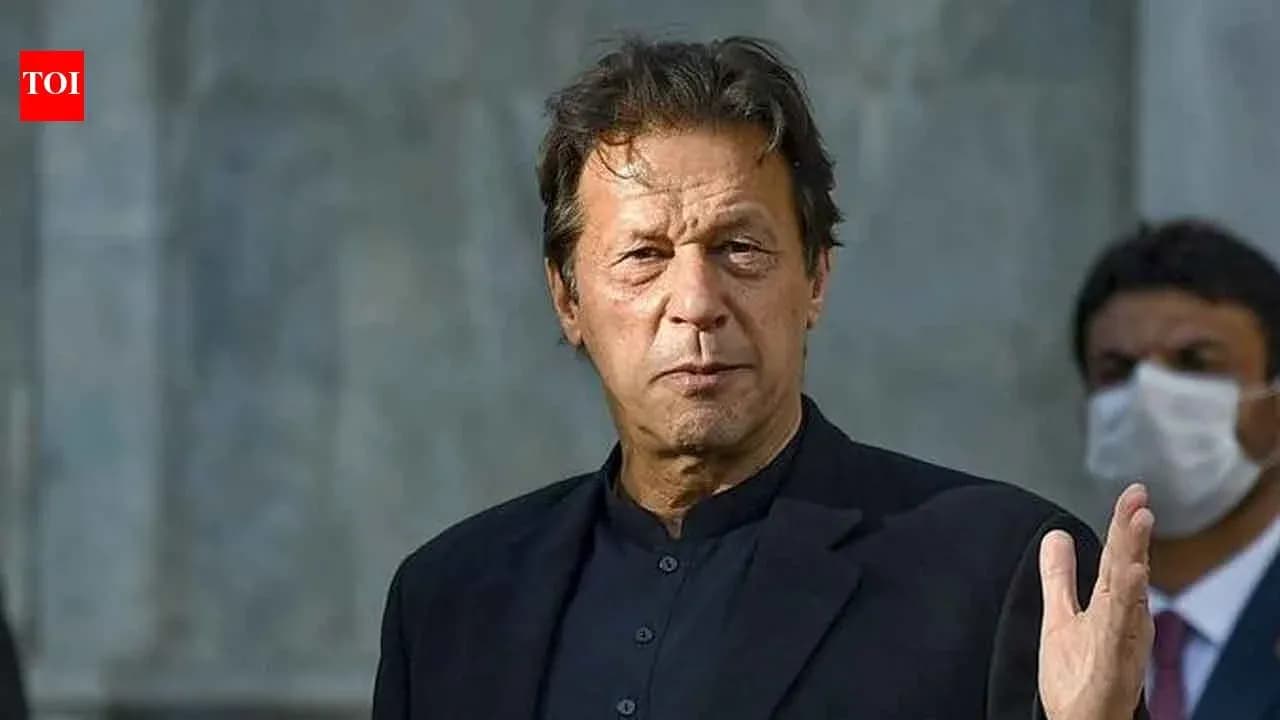 Man gesturing while speaking at a public event