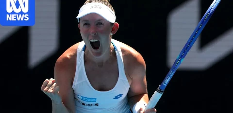 Tennis player celebrating victory with raised fist