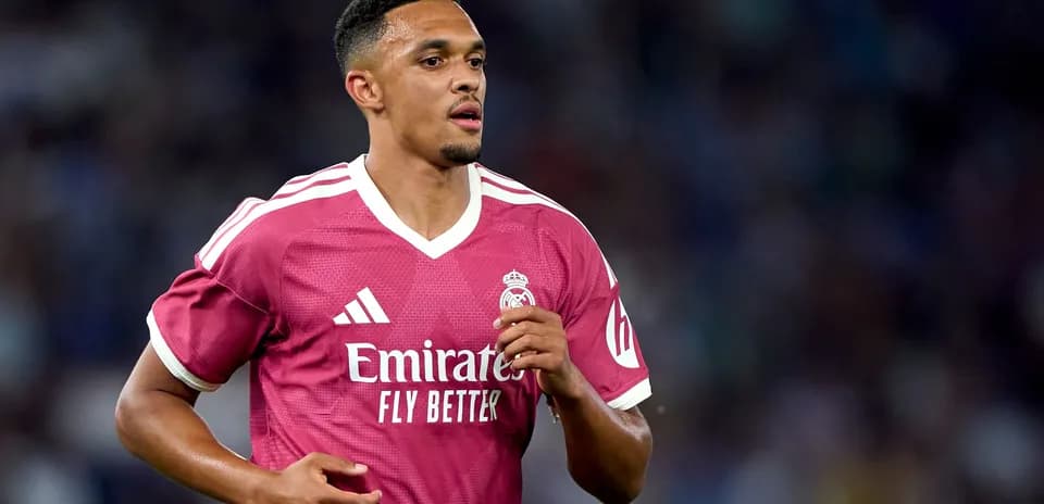 Player running in pink Real Madrid jersey