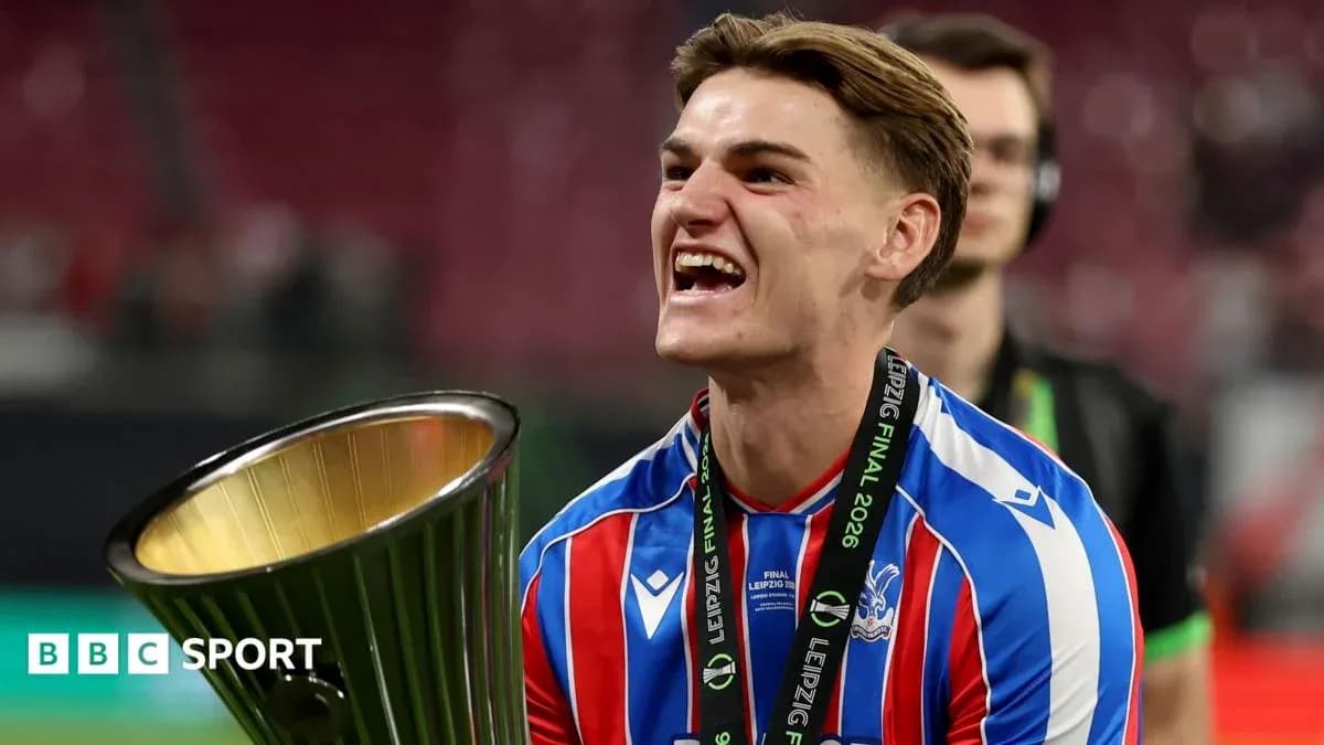Player celebrating with trophy after winning match