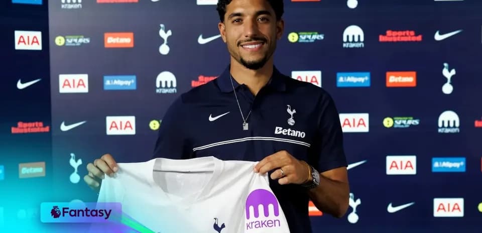 Player holding Tottenham Hotspur jersey at announcement