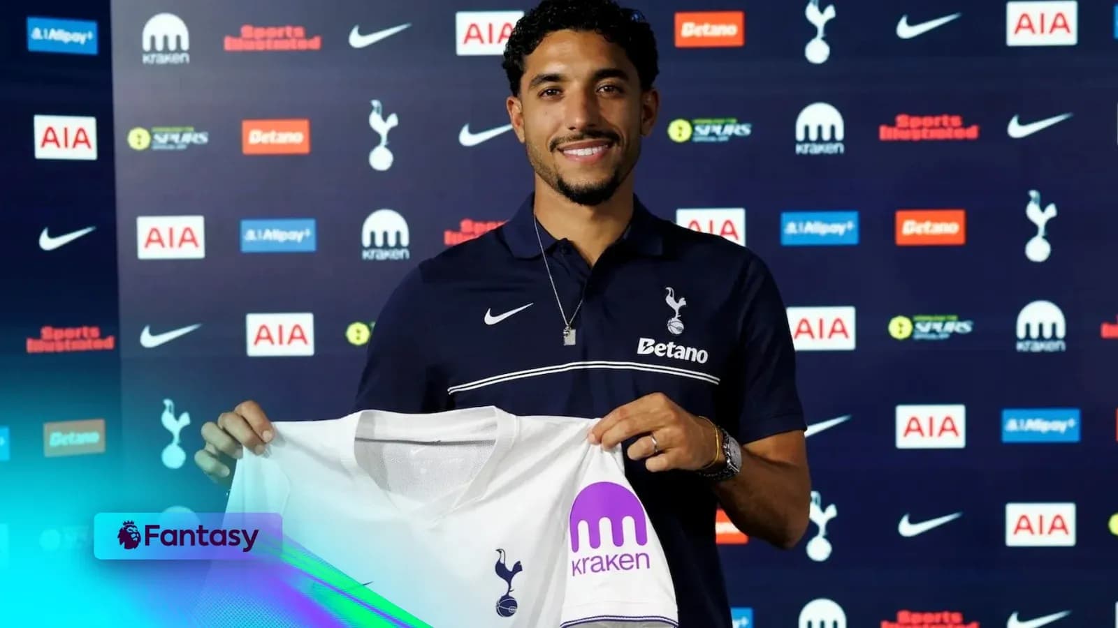 Player holding Tottenham Hotspur jersey at announcement