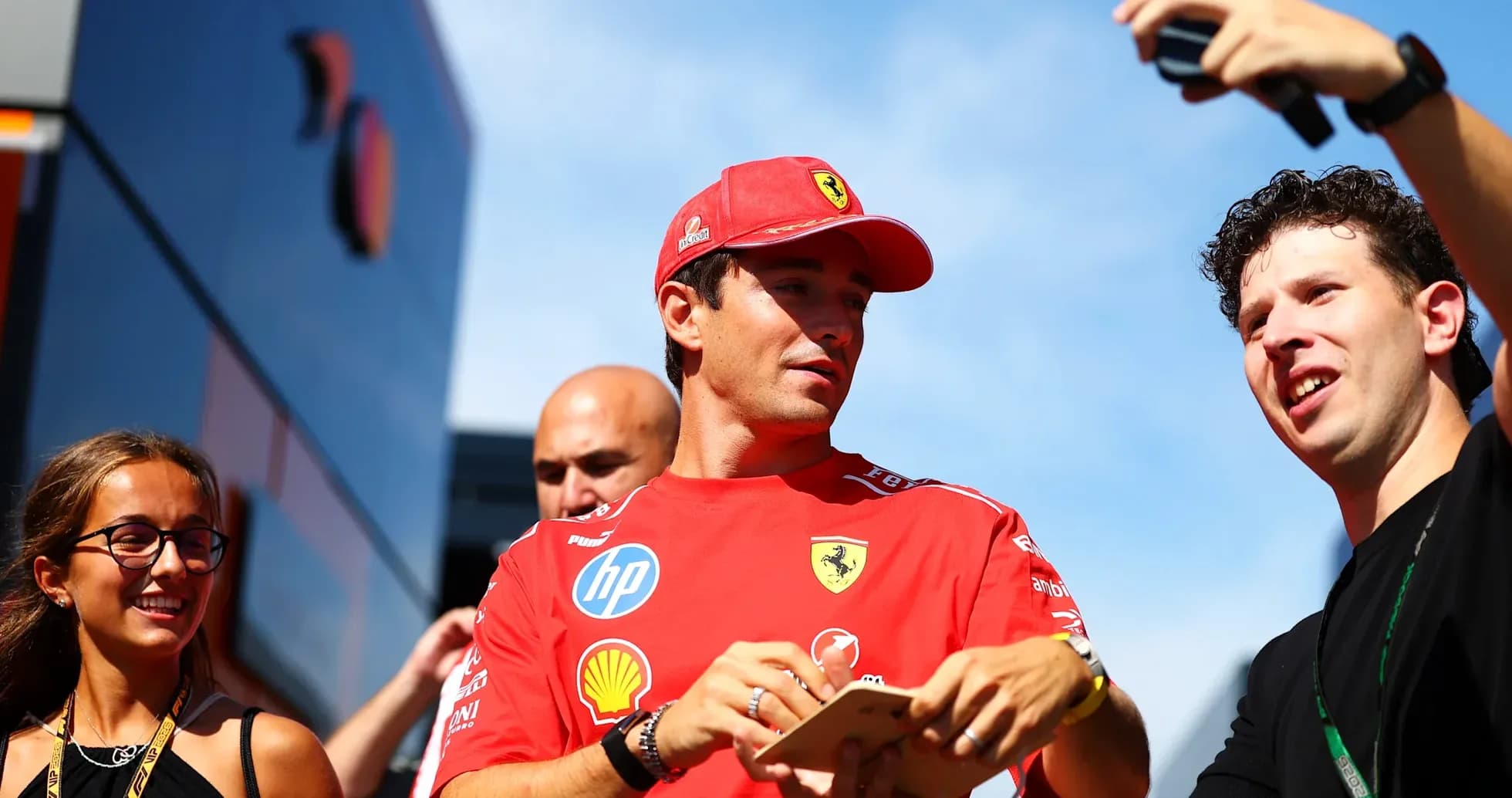 Driver interacting with fans during event appearance