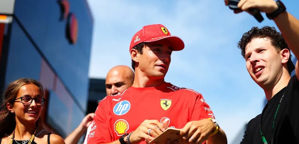 Driver interacting with fans during event appearance