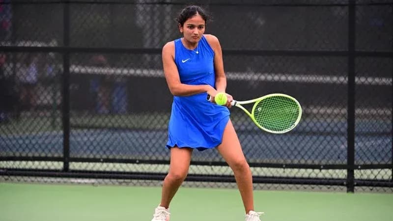 Female tennis player preparing to hit a ball