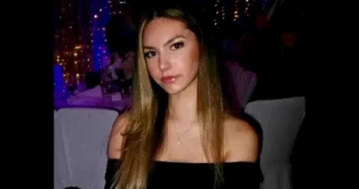 Young woman posing at a formal event
