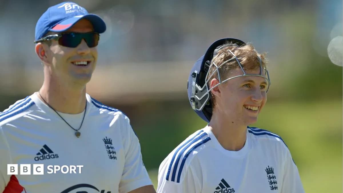 Two cricketers smiling during a training session