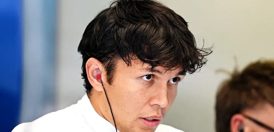 Driver wearing earphones during team meeting