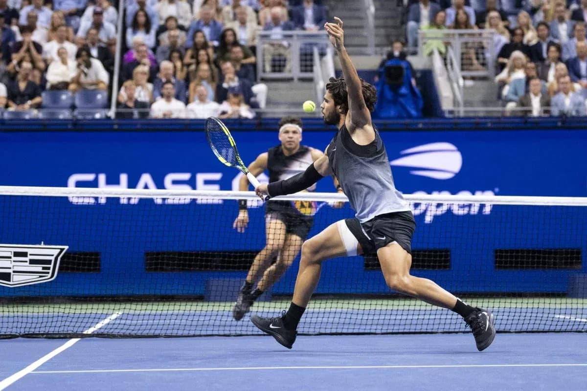 Player lunging to hit a tennis ball during match