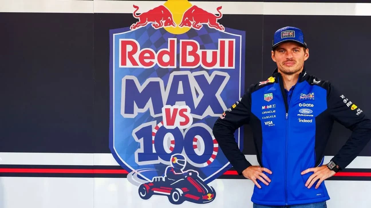 Driver posing in front of Red Bull branding
