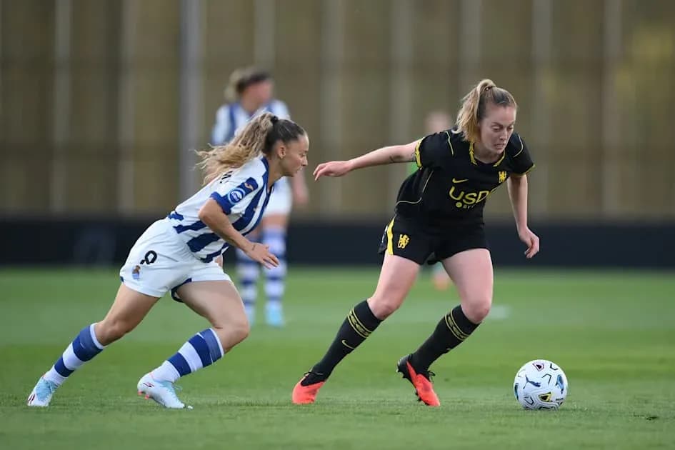 Two players competing for the ball during match