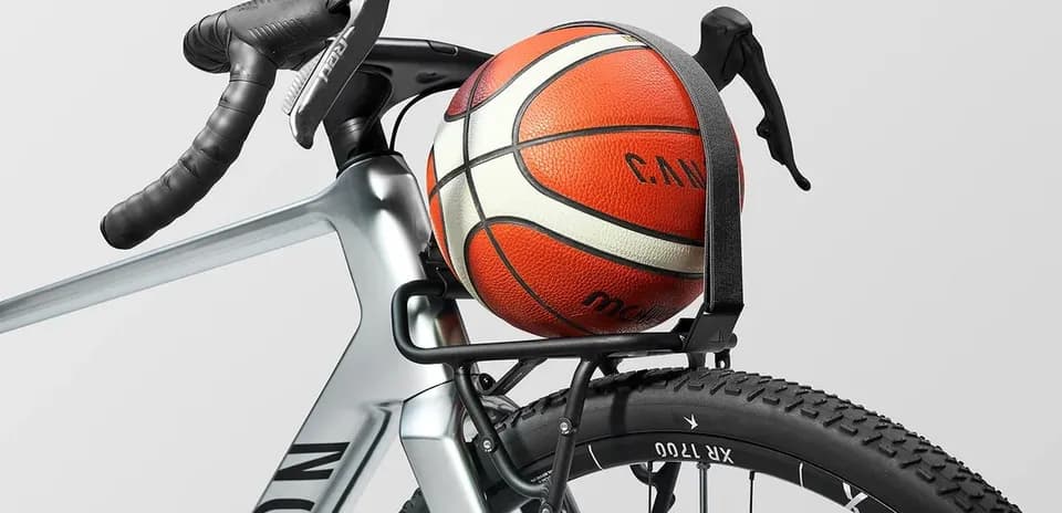 Basketball resting on a bicycle rack