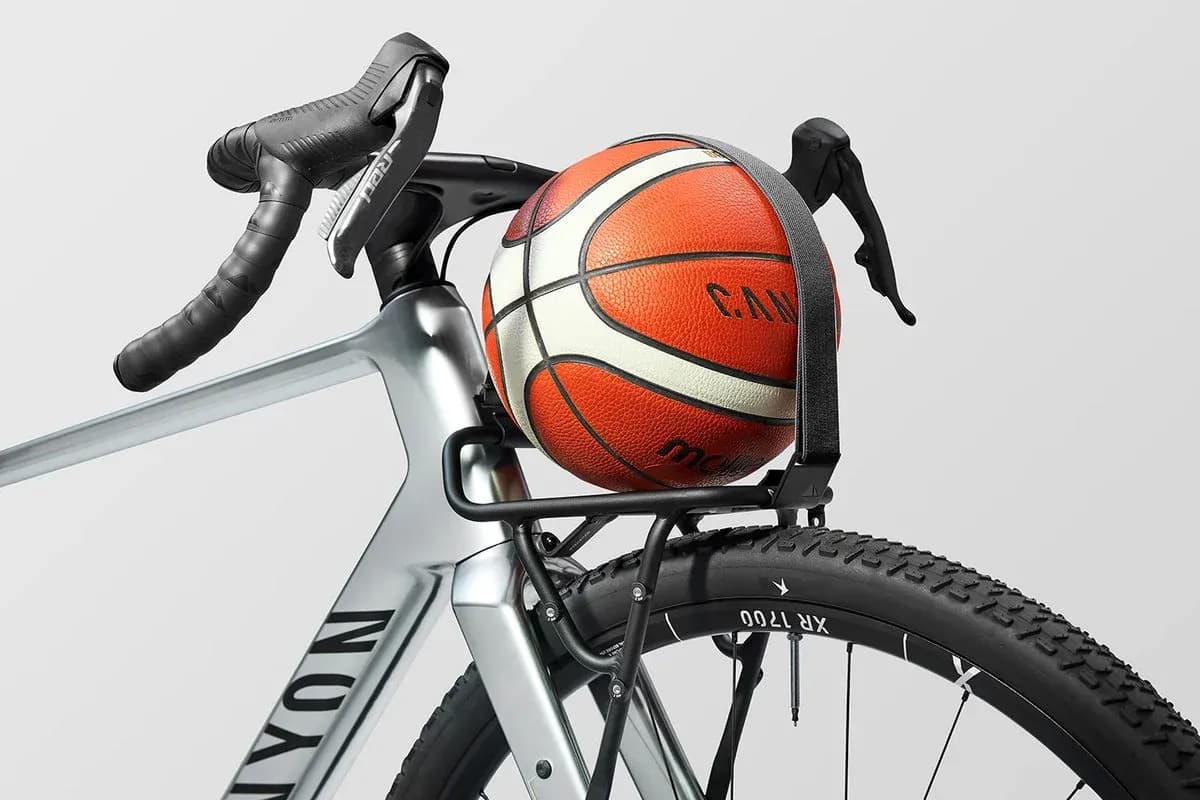 Basketball resting on a bicycle rack