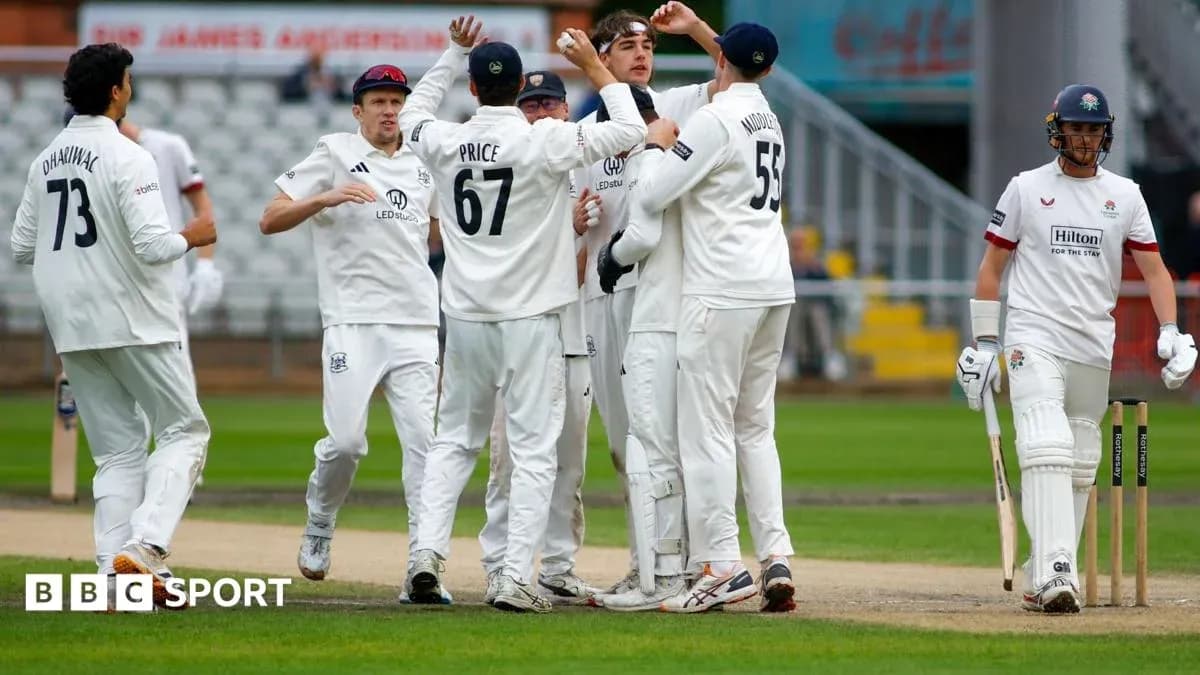 Cricket players celebrating a wicket on the field