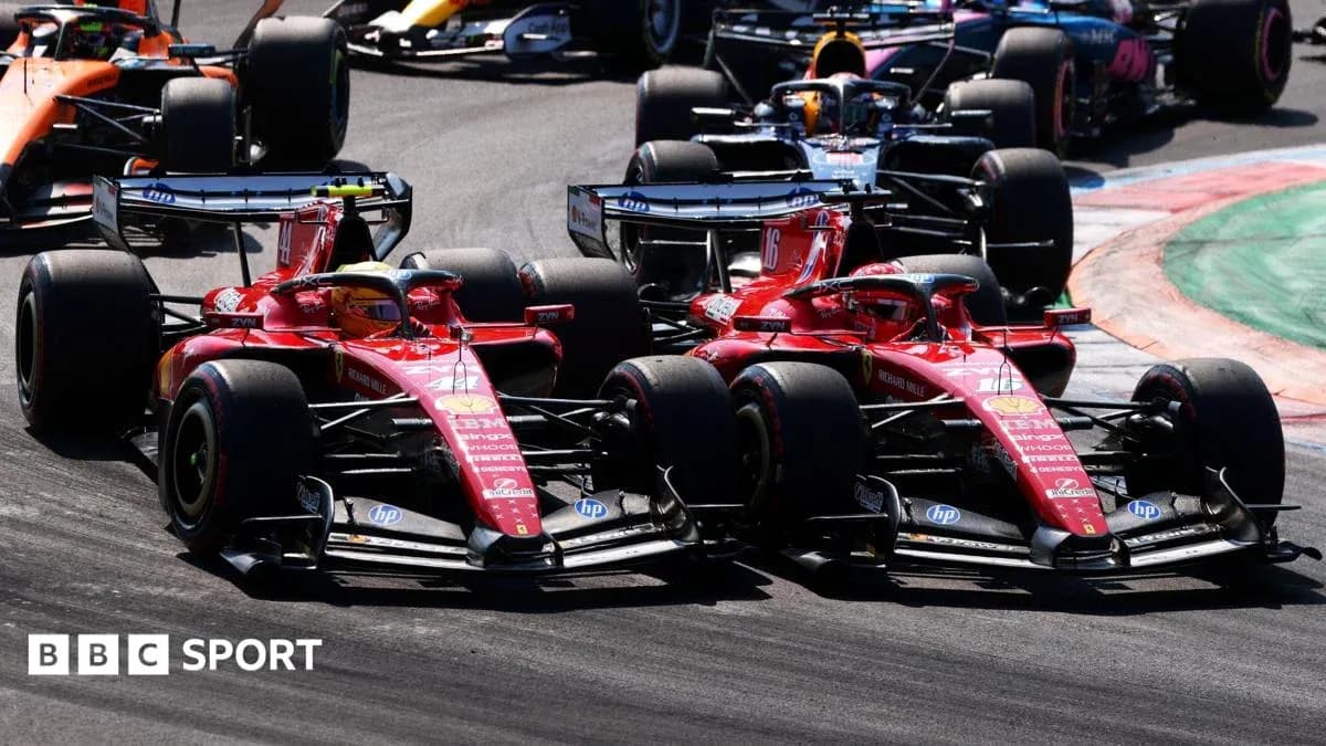 Two Ferrari cars racing closely during Formula 1 event
