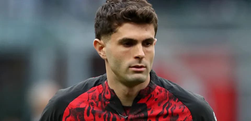 Player wearing red and black jersey during match