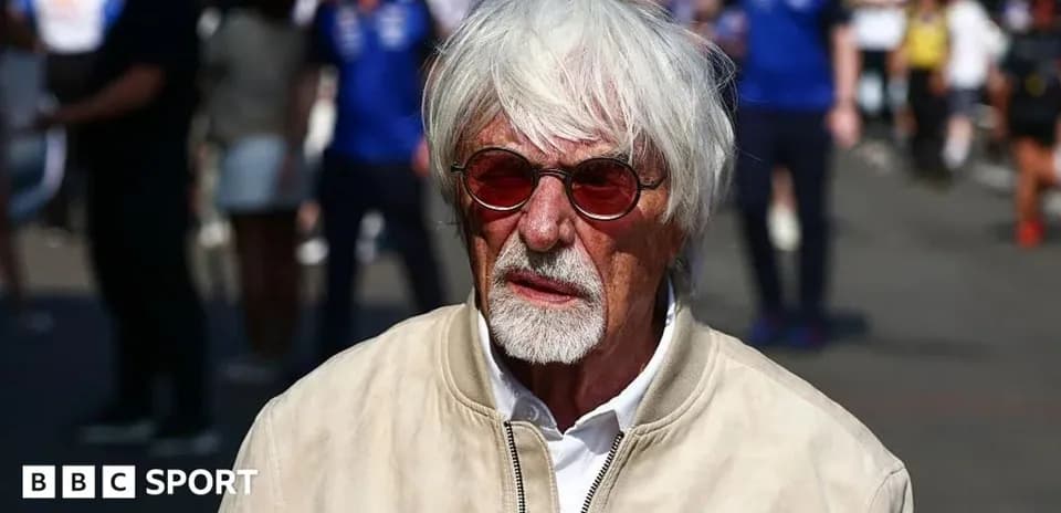 Man with white hair and sunglasses at event