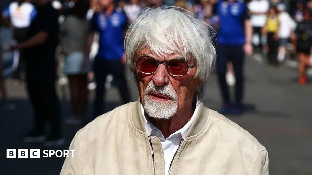Man with white hair and sunglasses at event