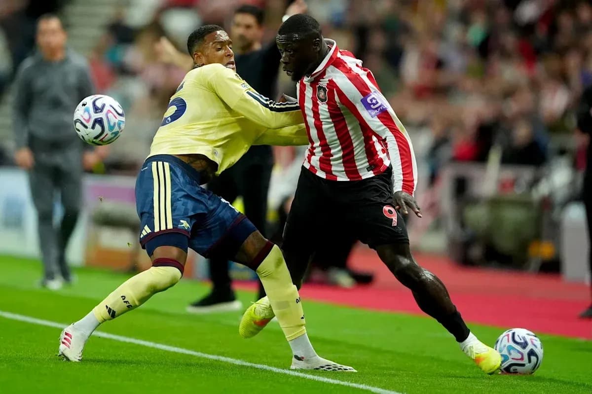 Two players contesting for the ball during match