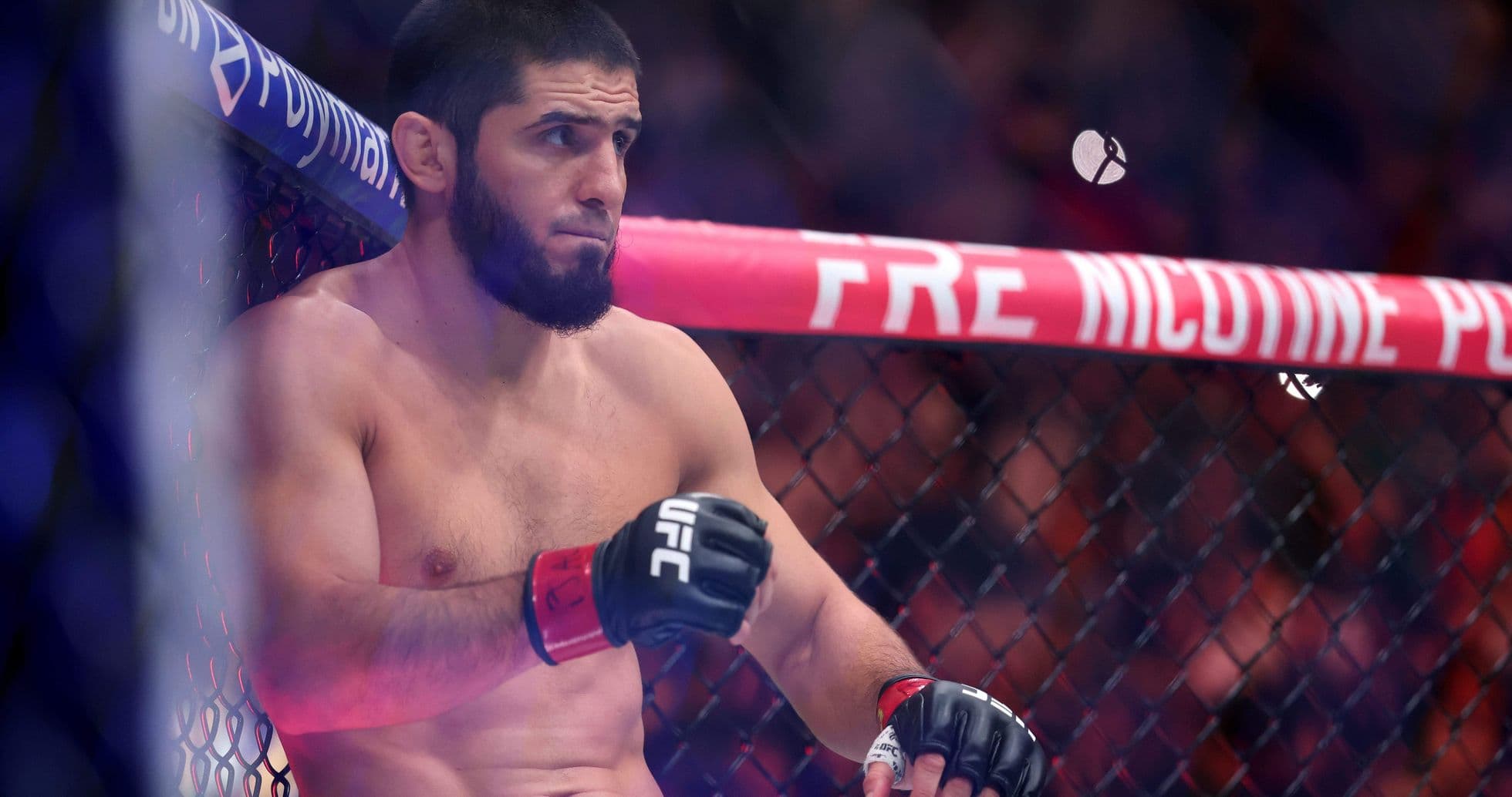Fighter sitting in corner of UFC octagon