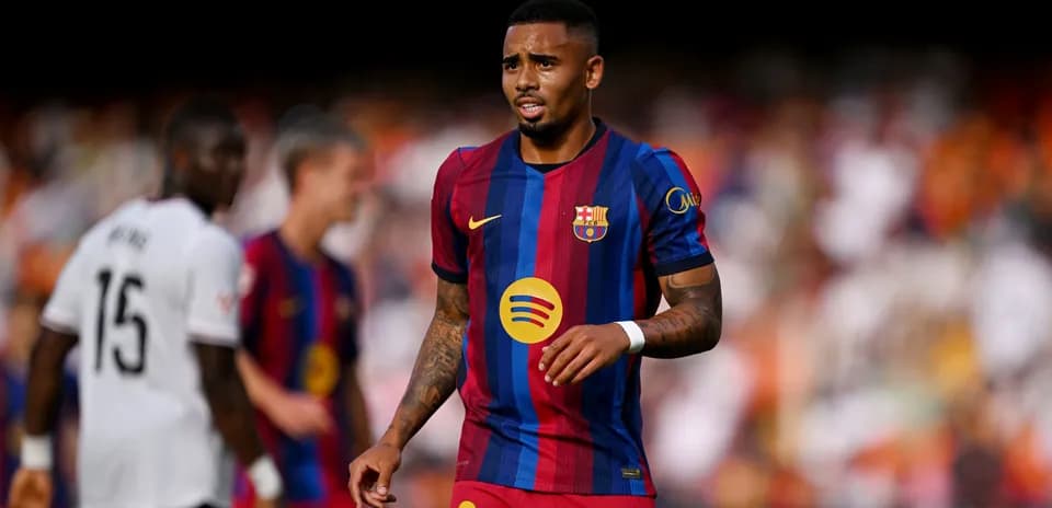 Player wearing FC Barcelona jersey on the pitch
