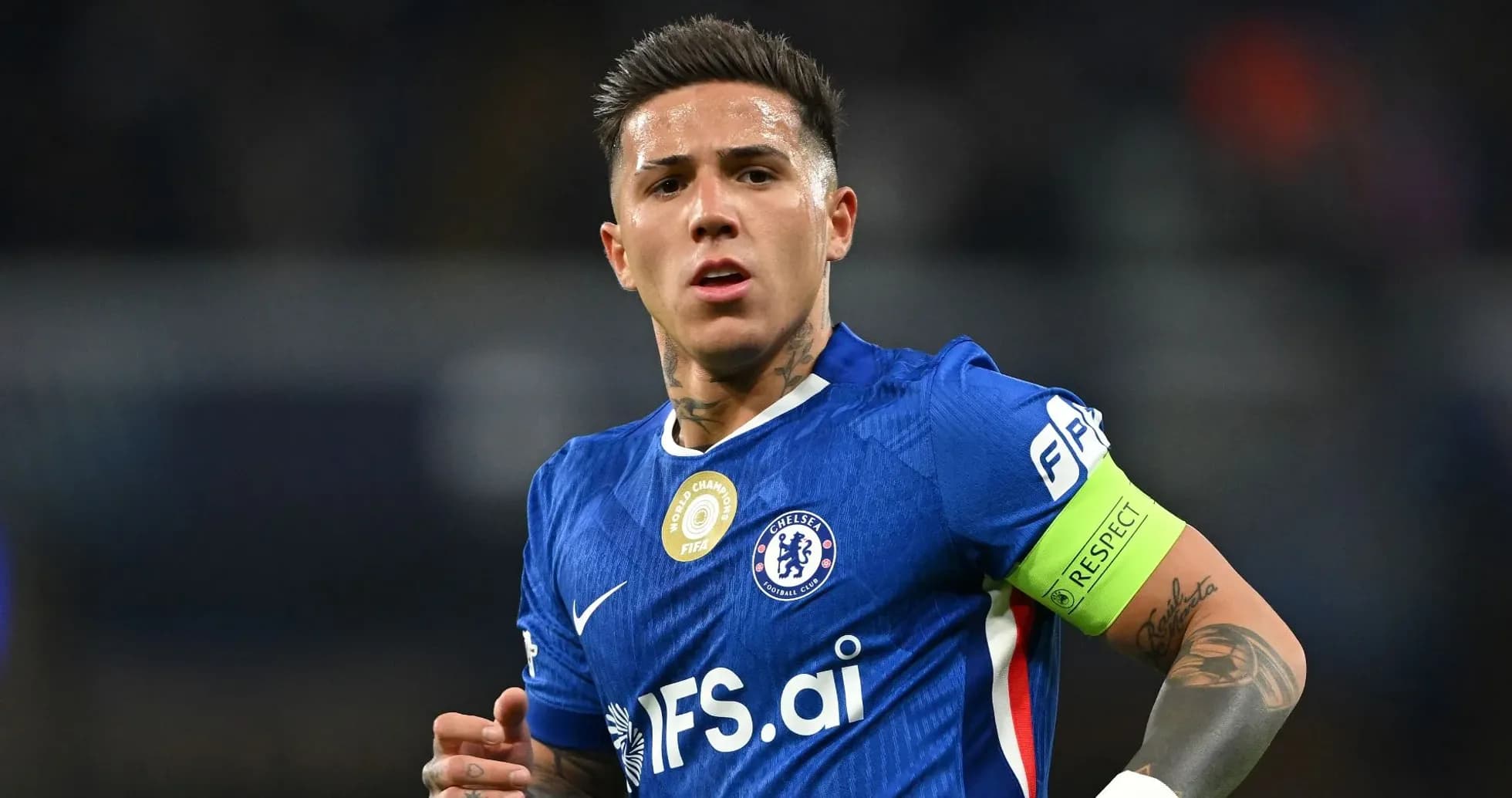 Player wearing Chelsea kit with captain's armband