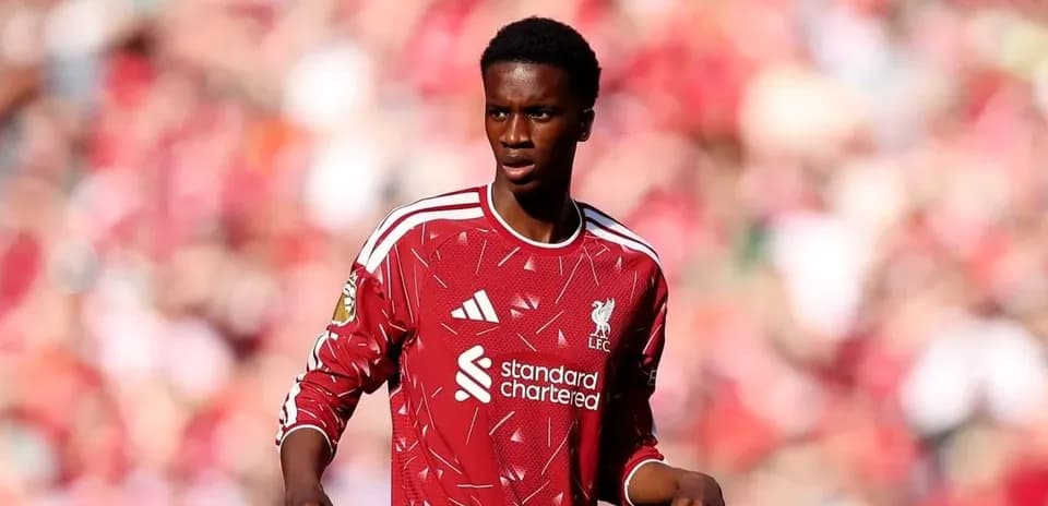 Player in red Liverpool jersey on the pitch