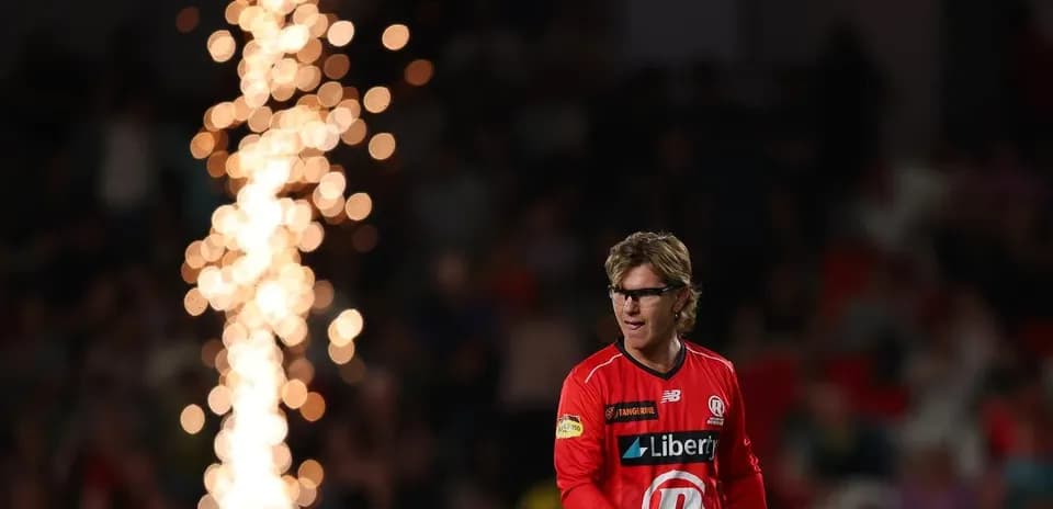Player walking past fireworks during a match