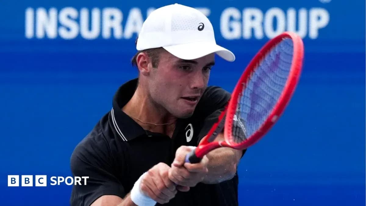 Tennis player hitting a forehand during match