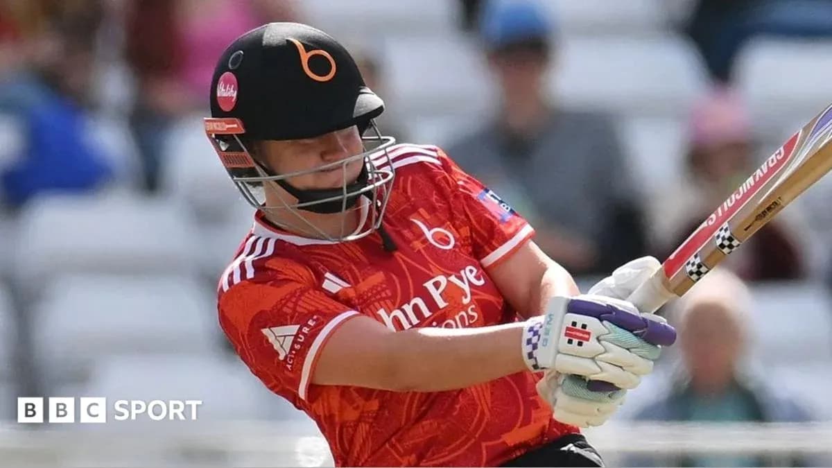 Batter striking the ball during cricket match